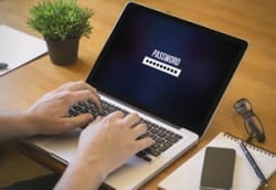 entering password on laptop