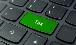 keyboard with word tax on it