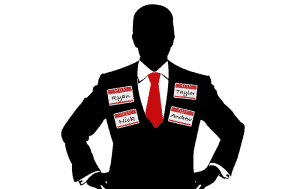 Man with serveral name tags signifying identity theft