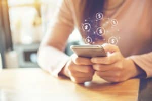 Woman holding a smartphone to do her banking