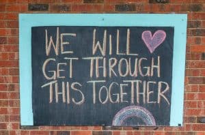 Chalk message saying "We will get through this together."