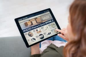 woman using a tablet for online shopping