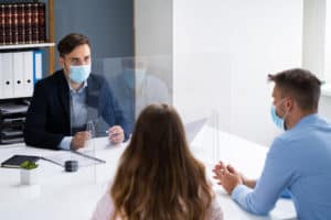 A banker Consulting Family Couple With Face Mask