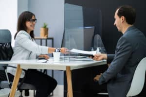 Client Signing Document At Desk