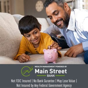 Man and young son saving money with a piggy bank